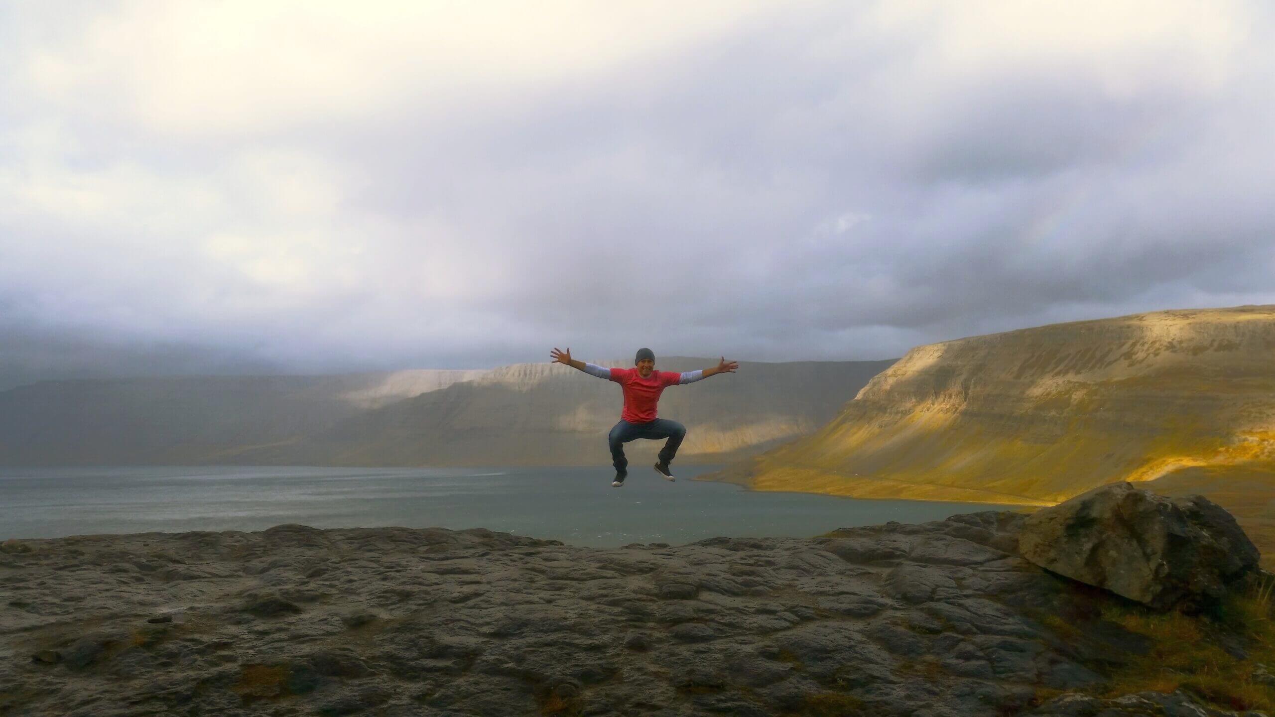 Coach Hector Jumping in the Mountains